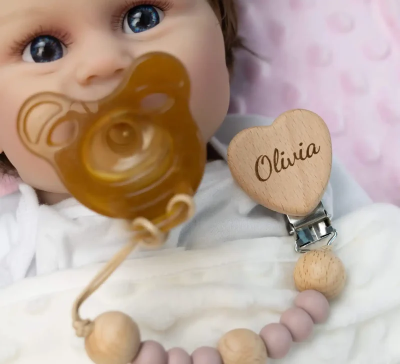 littlecustombaby personalized name baby wooden pacifier clip light pink usage scenario photo